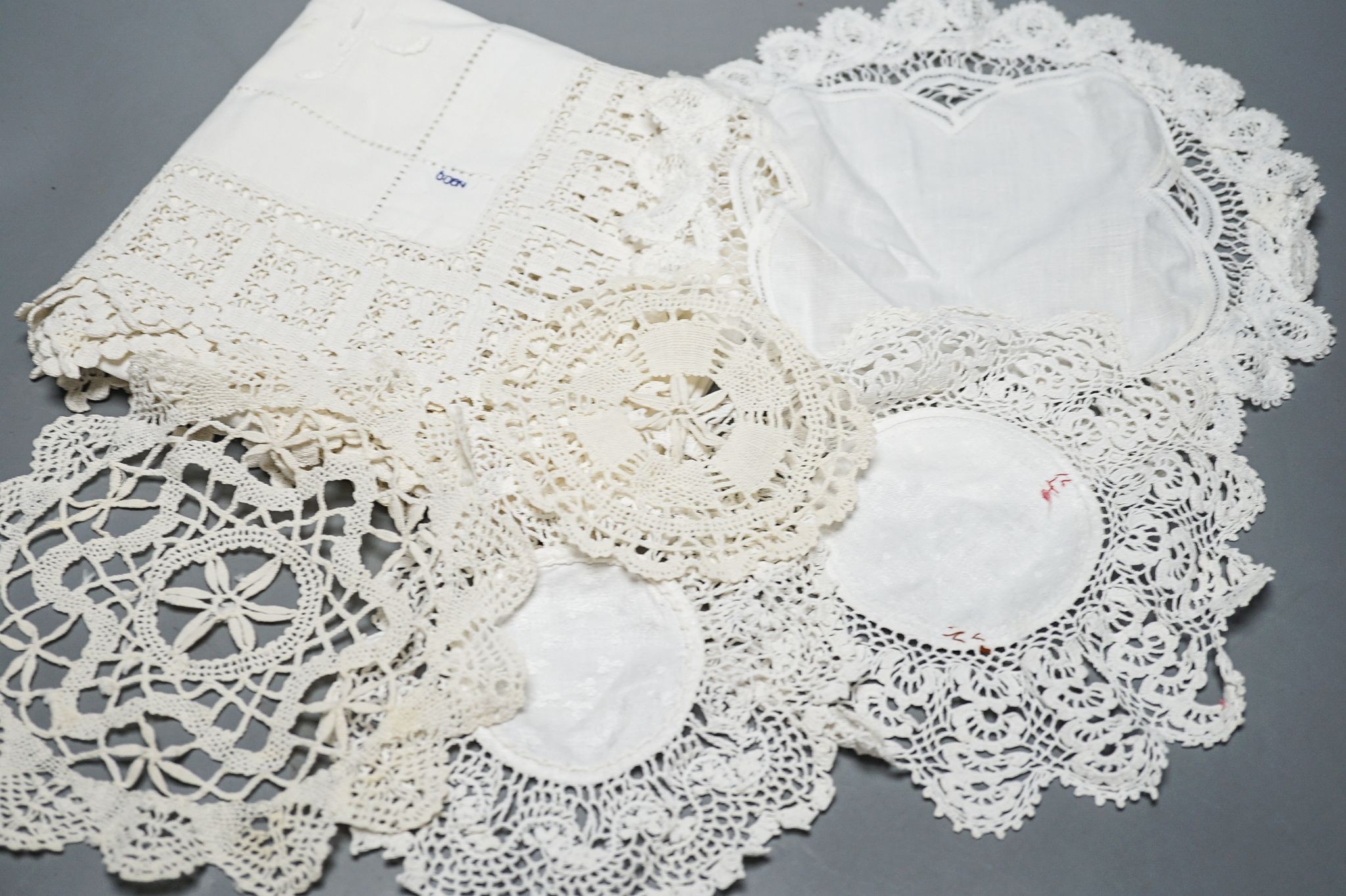 A quantity of mixed crochet, embroidered and cut work table linens.